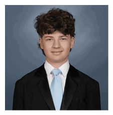 A young man wearing a suit and tie is smiling for the camera. AI generated content