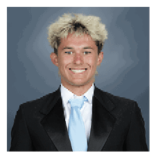 A young man wearing a suit and tie is smiling for the camera. AI generated content