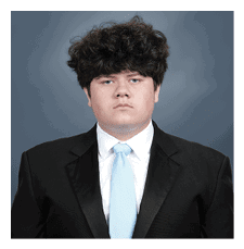 A young man wearing a suit and tie. AI generated content