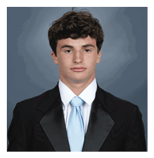 A young man wearing a suit and tie. AI generated content