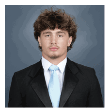 A young man wearing a suit and tie. AI generated content
