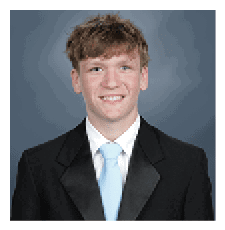 A young man wearing a suit and tie is smiling for the camera. AI generated content