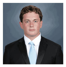 A young man wearing a suit and tie poses for a picture. AI generated content