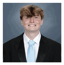 A young man wearing a suit and tie is smiling for the camera. AI generated content