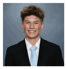 A young man wearing a suit and tie is smiling for the camera. AI generated content