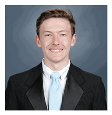 A young man wearing a suit and tie is smiling for the camera. AI generated content