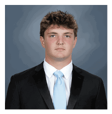 A young man wearing a suit and tie. AI generated content