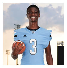 A young man wearing a blue football jersey and holding a football. AI generated content