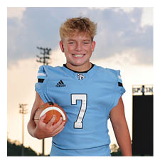A young man wearing a football uniform and holding a football. AI generated content