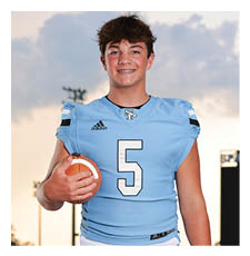 A young man wearing a football uniform and holding a football. AI generated content