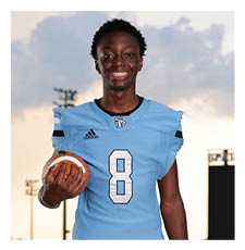A young man wearing a football uniform and holding a football. AI generated content