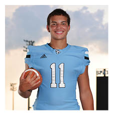 A football player in a blue uniform holding a football. AI generated content