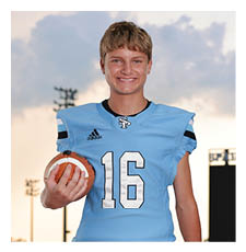A young man wearing a football uniform and holding a football. AI generated content