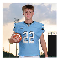 A young man wearing a football jersey and holding a football. AI generated content