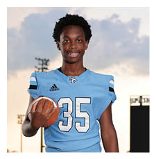 A young man wearing a football uniform and holding a football. AI generated content