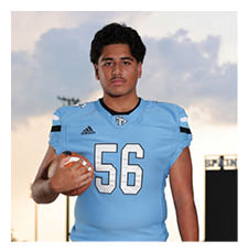 A football player wearing a blue jersey and holding a football. AI generated content