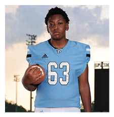 A football player wearing a blue jersey with the number 63 on it is holding a football. AI generated content