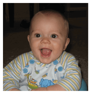 A baby is sitting in a blue and yellow chair, smiling and wearing a striped shirt. AI generated content