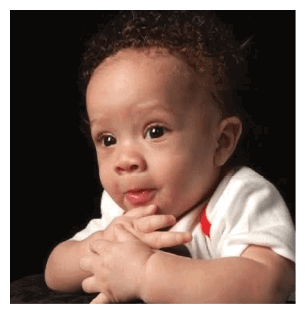 A baby is sitting on a cushion and looking at the camera. AI generated content