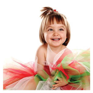A young girl wearing a green and red dress is smiling for the camera. AI generated content