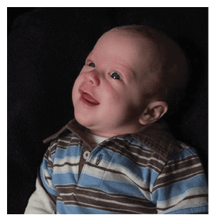 A baby wearing a striped shirt is smiling and looking up. AI generated content