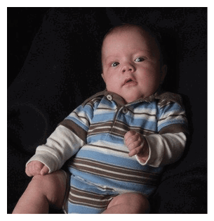 A baby wearing a striped shirt is sitting on a black surface. AI generated content