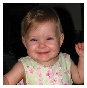 A young child wearing a green and white dress is smiling and waving. AI generated content