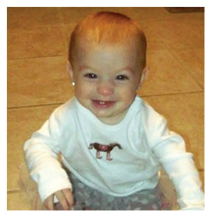 A young child is sitting on the floor wearing a white shirt with a horse on it. AI generated content