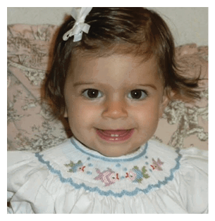 A young girl is smiling and wearing a white dress with a blue collar. AI generated content