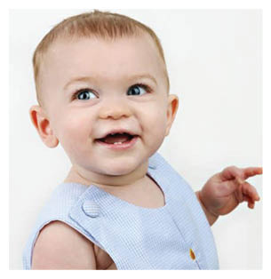 A young child wearing a blue shirt and holding a green object. AI generated content