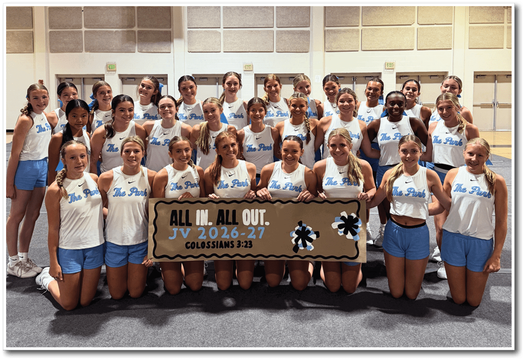 A group of cheerleaders pose for a picture in front of a banner. AI generated content