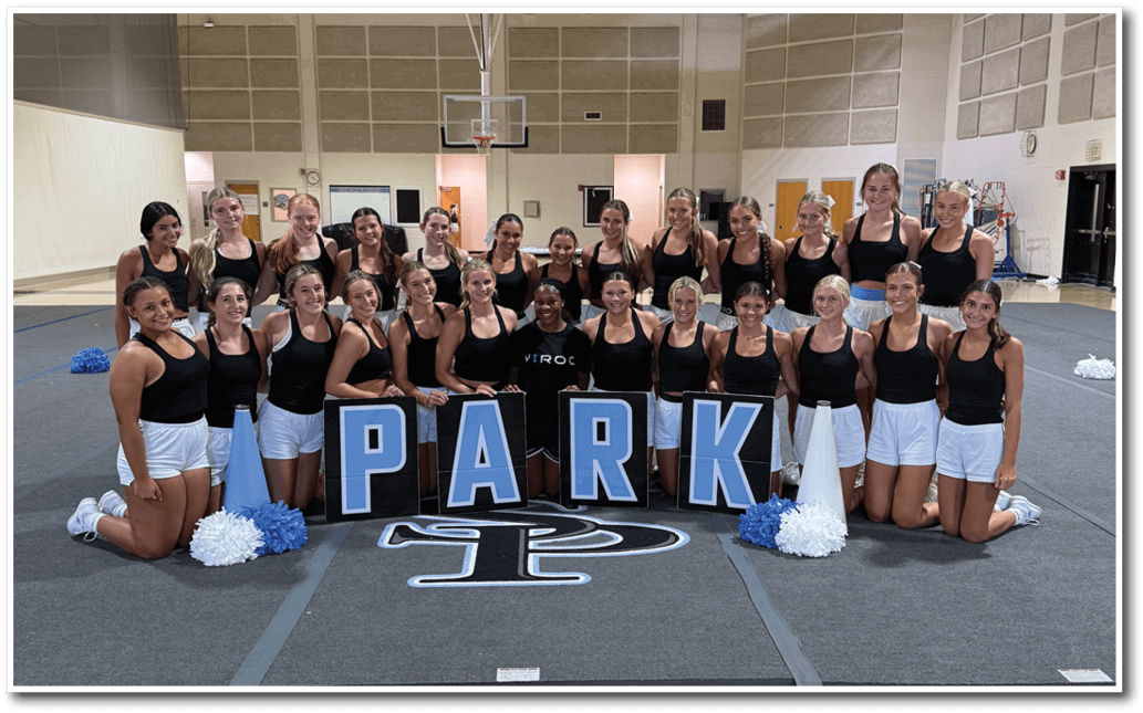 A group of cheerleaders pose for a picture on a basketball court. AI generated content