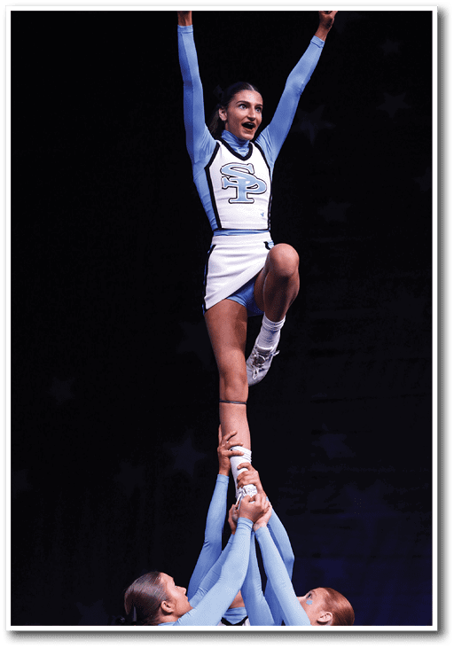 A group of cheerleaders are holding up a girl in the air. AI generated content