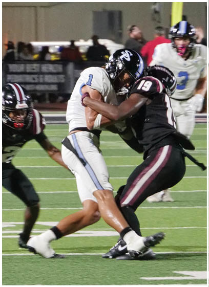 Two football players are on the field, one is tackling the other. AI generated content