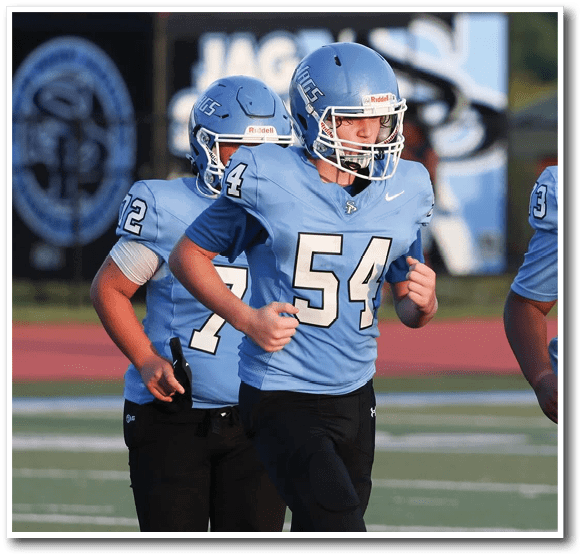 Three football players running on a field. AI generated content