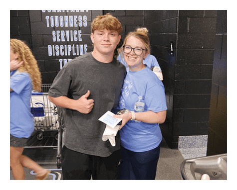 Two people standing in a room, one holding a piece of paper. AI generated content