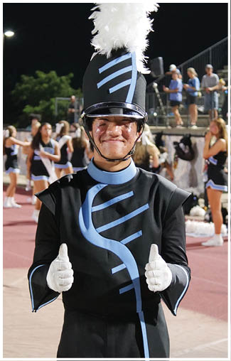 A man in a uniform is giving a thumbs up. AI generated content
