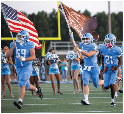 A group of football players are holding a flag and a banner. AI generated content