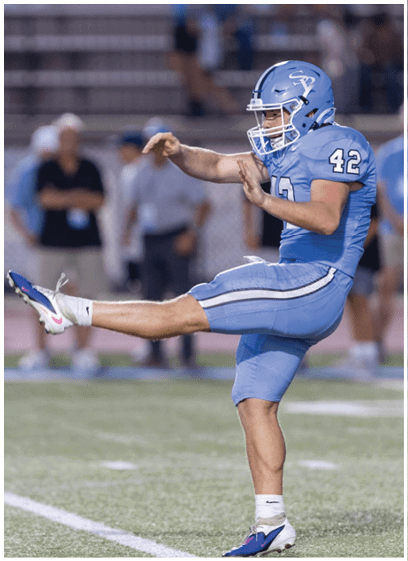 Two football players on a field, one kicking a ball and the other trying to block it. AI generated content