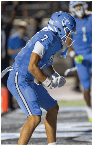 Two football players celebrating on the field. AI generated content