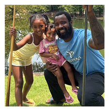 A man and two children pose for a picture with a pair of wooden poles. AI generated content