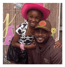 A man and a girl pose for a picture. The girl is wearing a pink cowboy hat and the man is wearing a brown hat. AI generated content