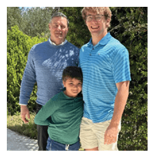 A man and a boy pose for a picture together. AI generated content