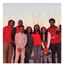 A family poses for a photo on the beach. AI generated content