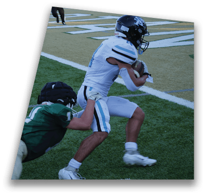 Two football players on a field, one in a green jersey and the other in a white jersey. The player in the white jersey is running with the ball. AI generated content