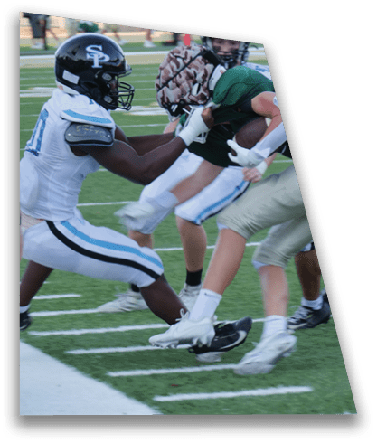 Two football players are fighting for the ball on the field. AI generated content