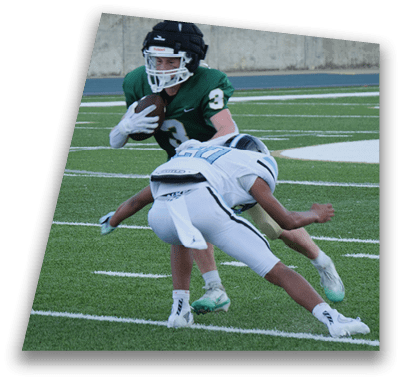 A football player is tackled to the ground by another player. AI generated content