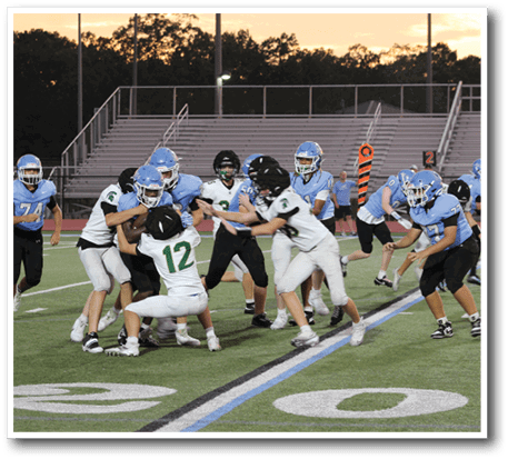 A group of football players on a field, some of them wearing helmets. AI generated content