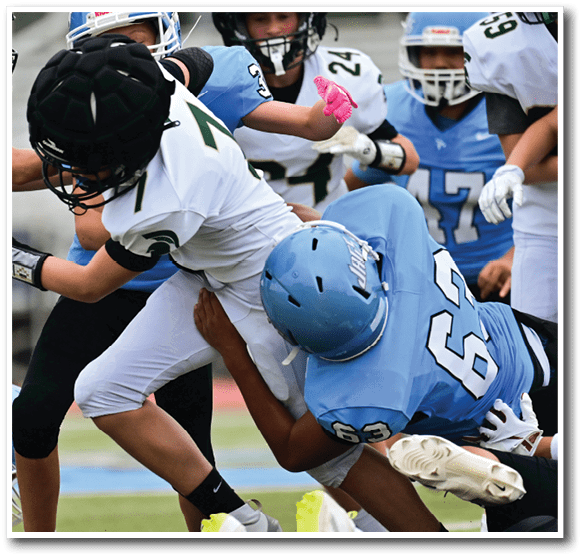 A group of young men playing football, one player is falling to the ground. AI generated content