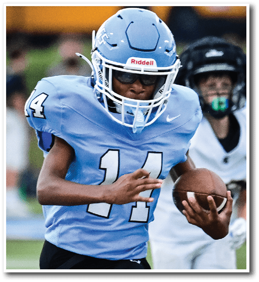 A young boy wearing a blue football jersey with the number 11 on it is running with a football in his hand. AI generated content